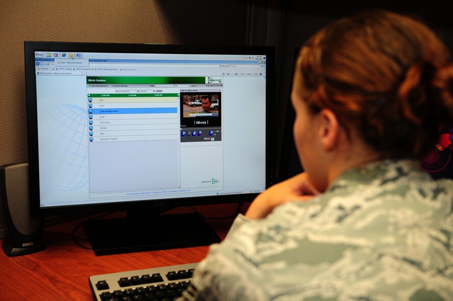 Airman 1st Class Allison La Praim, a general law paralegal of 1st Special Operations Wing Judge Advocate, watches internet protocol television on her computer at Hurlburt Field, Fla., April 5, 2012. IPTV enables users to watch television through the base network from their desktop computer. (U.S. Air Force photo/Airman 1st Class Gustavo Castillo)(Released)