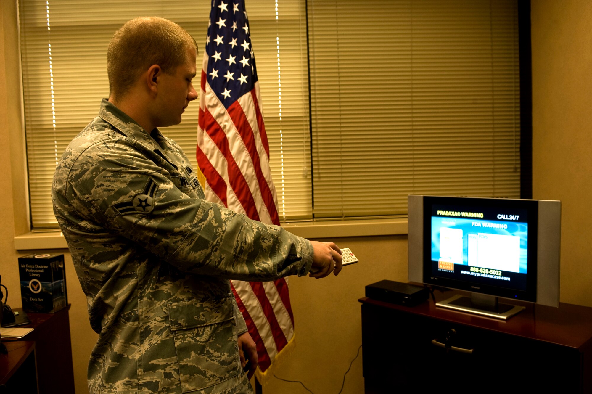 Airman 1st Class Bruce Williams, cyber systems operator of 1st Special Operations Communications Squadron, demonstrates how internet protocol television is broadcasted with the use of a set top box at his squadron at Hurlburt Field, Fla.,  March 27, 2012. A set top box enables users to connect IPTV to their television. (U.S. Air Force photo/Airman 1st Class Hayden Hyatt)(Released)  