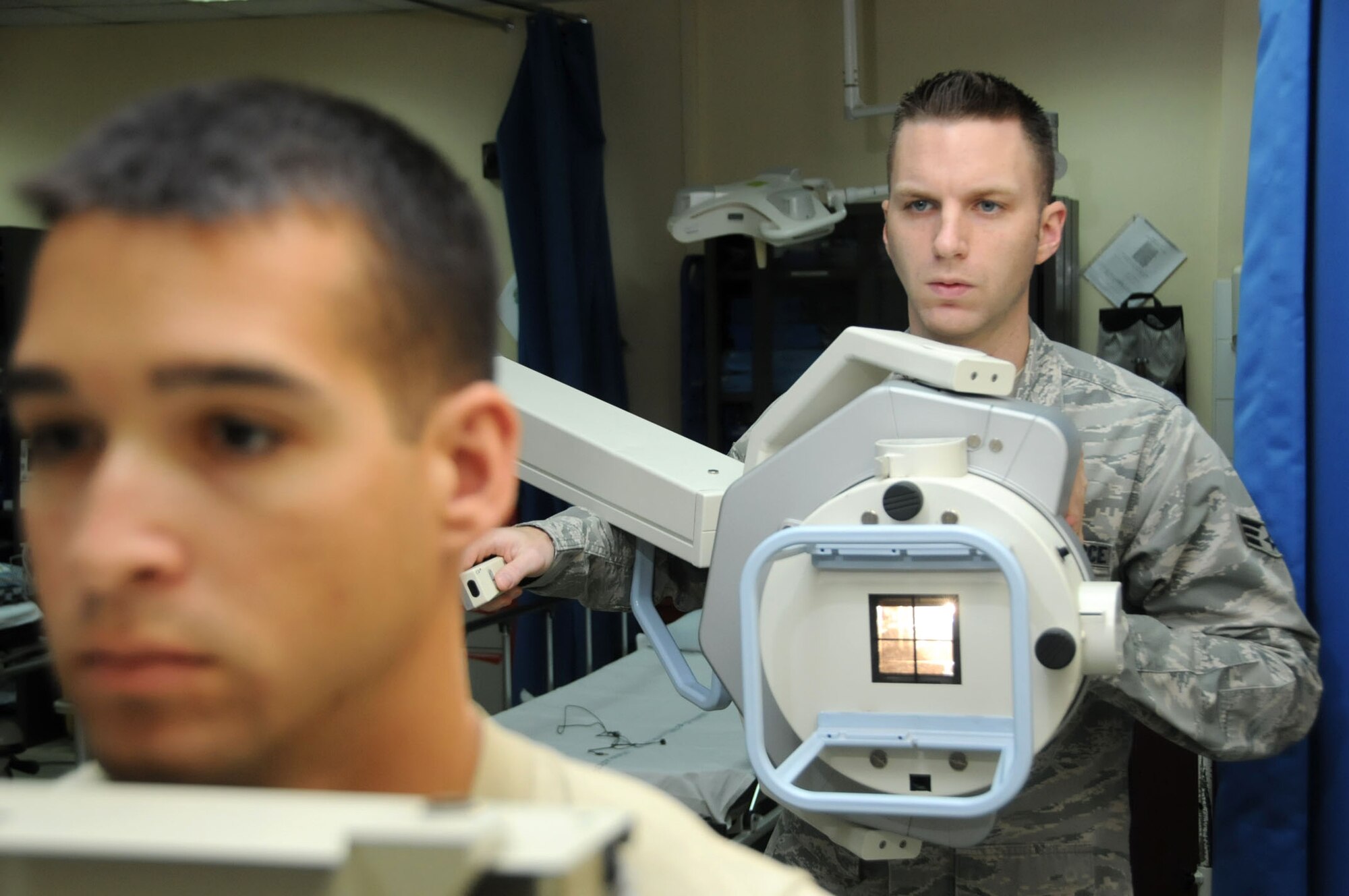U.S. Air Force Senior Airman Joseph Evans, 386th Expeditionary Medical Group diagnostic imaging technologist, uses a Siemens portable x-ray machine on a patient in an undisclosed location, Southwest Asia, April 5, 2012. Evans is deployed from the 96th Surgical Operations Squadron, Eglin Air Force Base, Fla., and is a native of Linden, N.J. (U.S. Air Force photo by Staff Sgt. James Lieth)