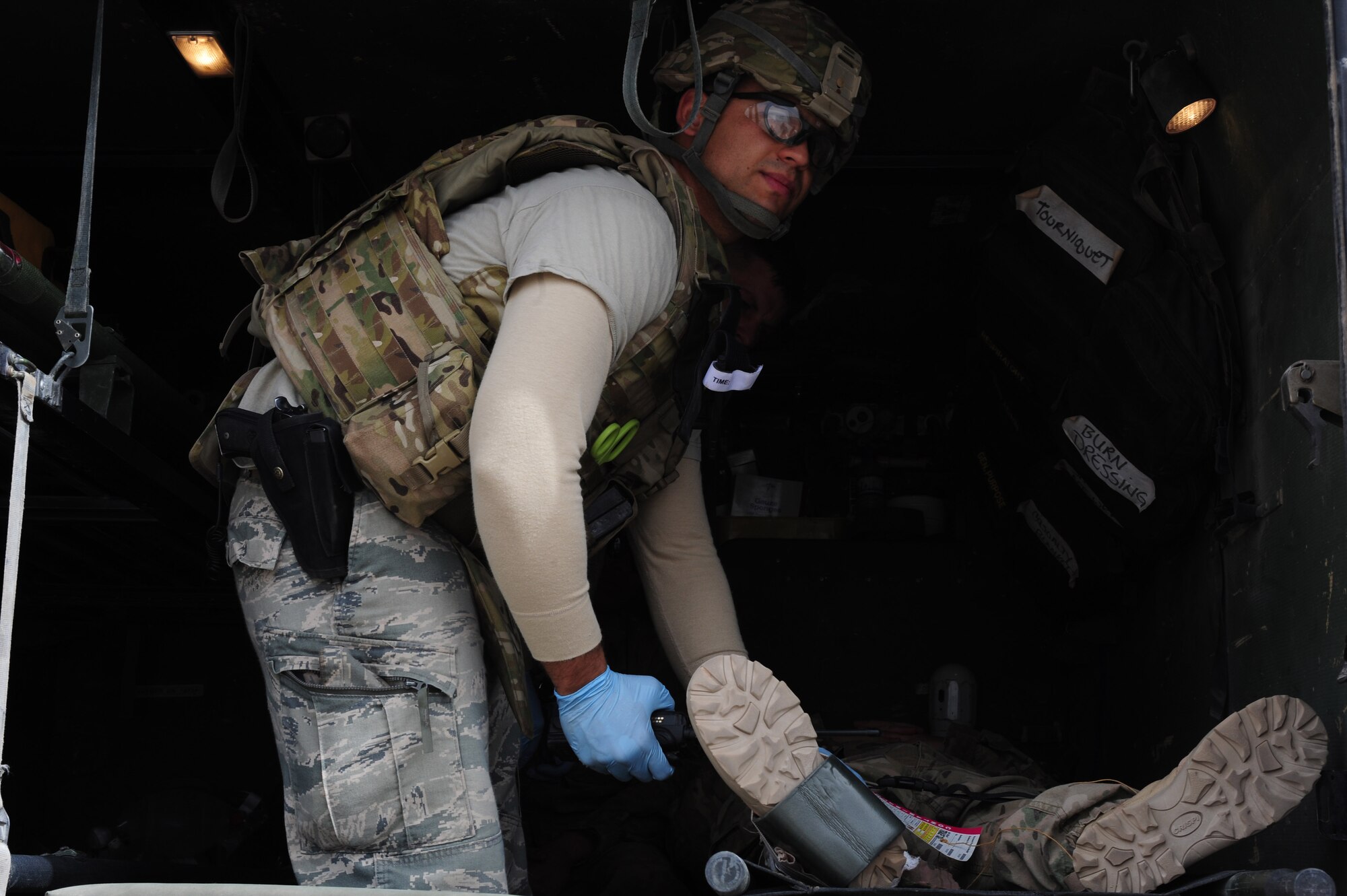 A U.S. Air Force medical Airman begins to treat a patient that sustained injuries friom a simulated blast during a mass causality exercise at Shindand Air Base, March 25, 2012. Responders from various fire, force protection and medical facilities joined the 838th AEAG to develop a seamless response capability able to quickly respond to threats in and around Shindand. (U.S. Air Force photo by Staff Sgt. Nadine Y. Barclay)