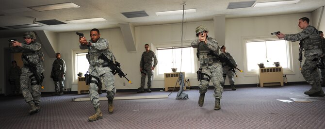 U.S. Airmen with the 35th Security Forces Squadron partake in High Risk Response Training at Misawa Air Base, Japan, March 30, 2012. High Risk Response Training helps SFS Airmen develop the skills they need to respond to active shooters. Regular training exercises like this, gave 35 SFS Airmen the ability to develop the skills and knowledge that resulted in the squadron earning the Air Force Outstanding Security Forces Medium Unit 2011. (U.S. Air Force photo/Airman 1st Class Kia Atkins/Released) 
