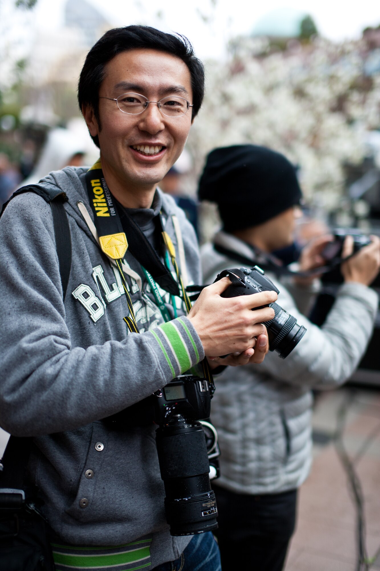 EBISU GARDEN PLACE -- Takayoshi Ishikawa, a local photographer, attends another Band of the Pacific-Asia performance at the Cherry Blossom Centennial opening, Ebisu Garden Place, Tokyo, Japan, Mar. 31, 2012.. Ishikawa routinely photographs and videos, always sharing his media with the band. (U.S. Air Force photo/Staff Sgt. Josh Voyles)