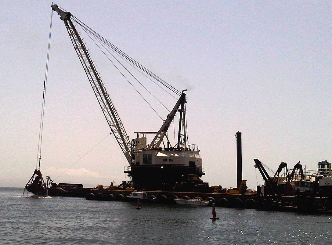 The clamshell dredge Paula Lee scoops up sediment from the Marina del Rey harbor entrance channel during operations in Marina del Rey, Calif., April 5. Removing sediment from the navigation channel there will enhance safety for government, commercial and recreational boaters.