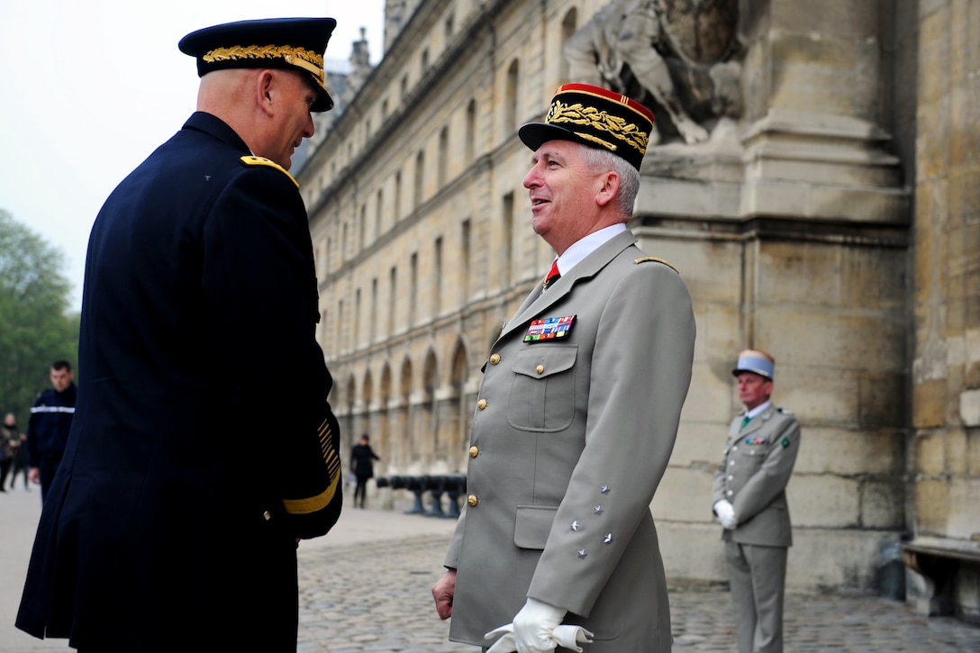 French Army Chief of Staff Gen. Bertrand Ract-Madoux, greets U.S. Army Chief of Staff Gen. Raymond T. Odierno at the entrance of L'Hôtel National Des Invalides [The National Residence of the Invalids], in Paris, April 5, 2012.