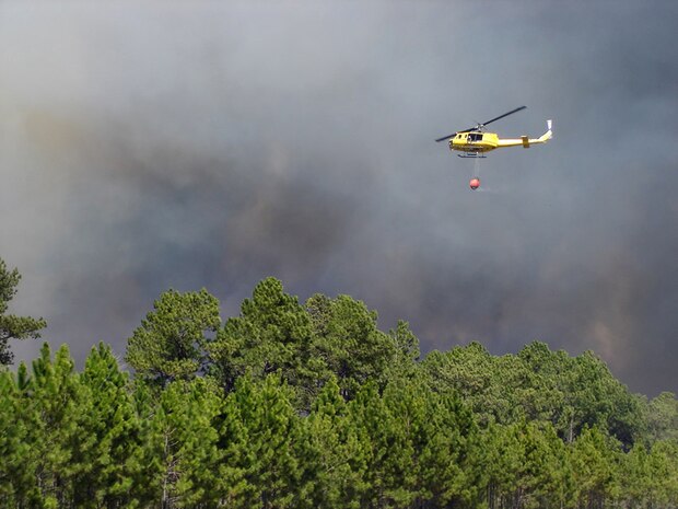MARINE CORPS BASE CAMP LEJEUNE, N.C. - Crews from the Camp Lejeune Fire Department and the North Carolina State Forestry Service worked to contain two wildfires all within the Greater Sandy Run Area in March 2011.