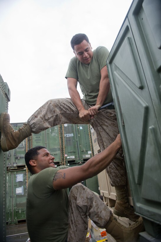 Marines with Combat Logistics Battalion 11 open a container aboard USS Pearl Harbor here April 6. The battalion provides logistics and services for the 11th Marine Expeditionary Unit. The unit is deployed as part of the Makin Island Amphibious Ready Group, a U.S. Central Command theater reserve force. The group is providing support for maritime security operations and theater security cooperation efforts in the U.S. Navy’s 5th Fleet area of responsibility.