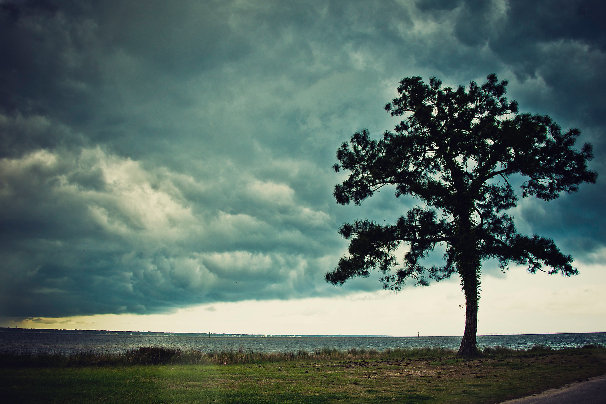 Storm clouds roll in blanketing the sky over Post’l Point April 5 at Eglin Air Force Base, Fla.  The storm brought a quick, but heavy downpour of rain to the base.  (U.S. Air Force photo/Samuel King Jr.)