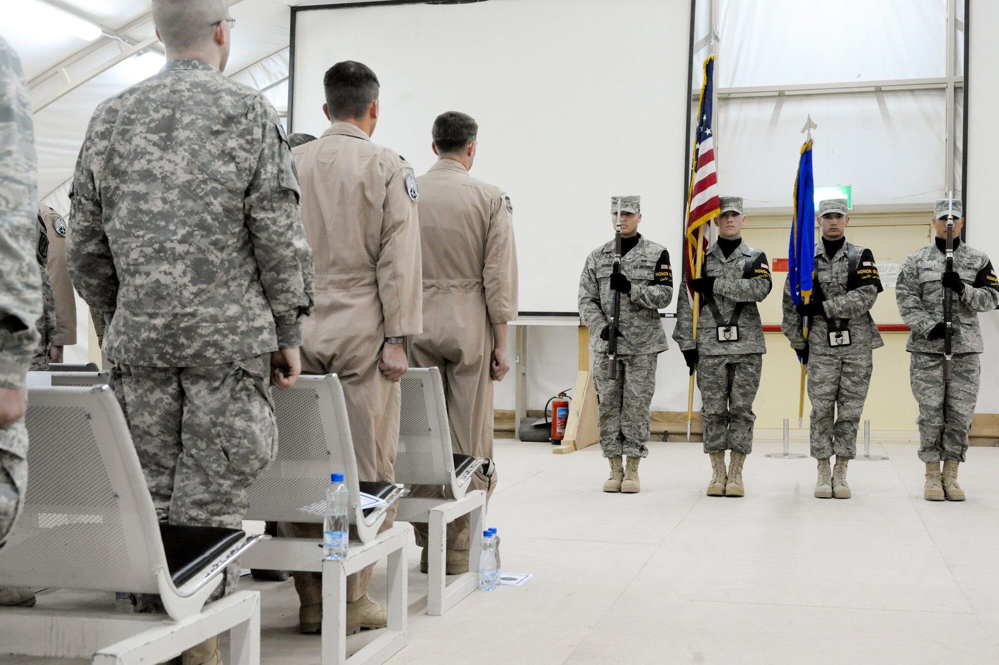 SOUTHWEST ASIA -- Members of the 332nd Air Expeditionary Wing honor guard team present the colors during the 82nd Expeditionary Air Support Operations Squadron activation ceremony here, April 6, 2012. The 82nd EASOS is the newest addition to the 332nd AEW and works in coordination with a U.S. Army unit to complete their mission. (U.S. Air Force photo by Staff Sgt. Joshua J. Garcia)