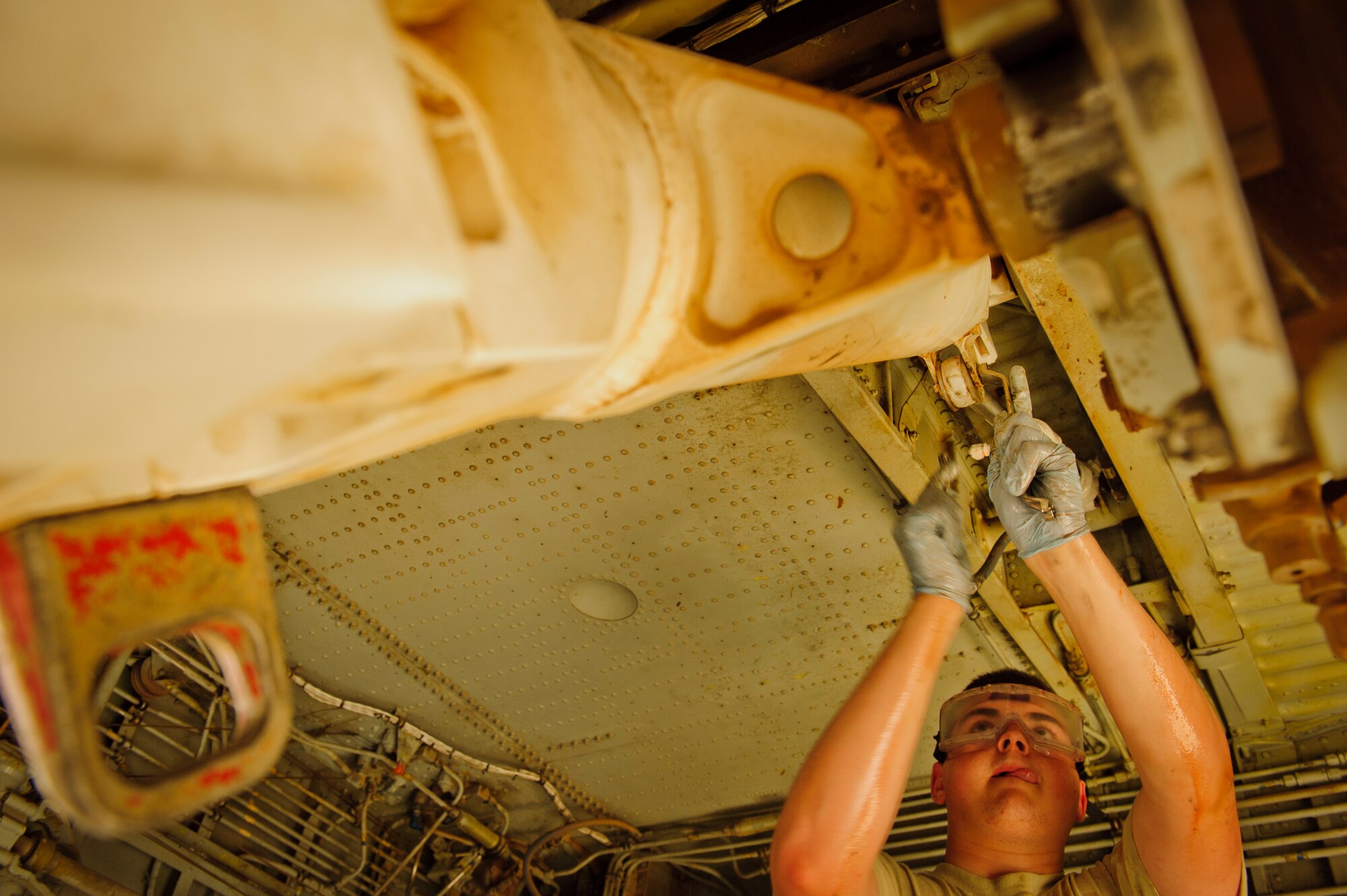 SOUTHWEST ASIA – Airman 1st Class Johnathan Holmes, 340th Expeditionary Aircraft Maintenance Unit hydraulics specialist and native of Hampden, Maine, removes the side strut actuator for the main landing gear on a KC-135 Stratotanker here April 4. The actuator, which allows the landing gear to be stowed after take-off, was leaking and needed replacement. (U.S. Air Force photo/Staff Sgt. Nathanael Callon)