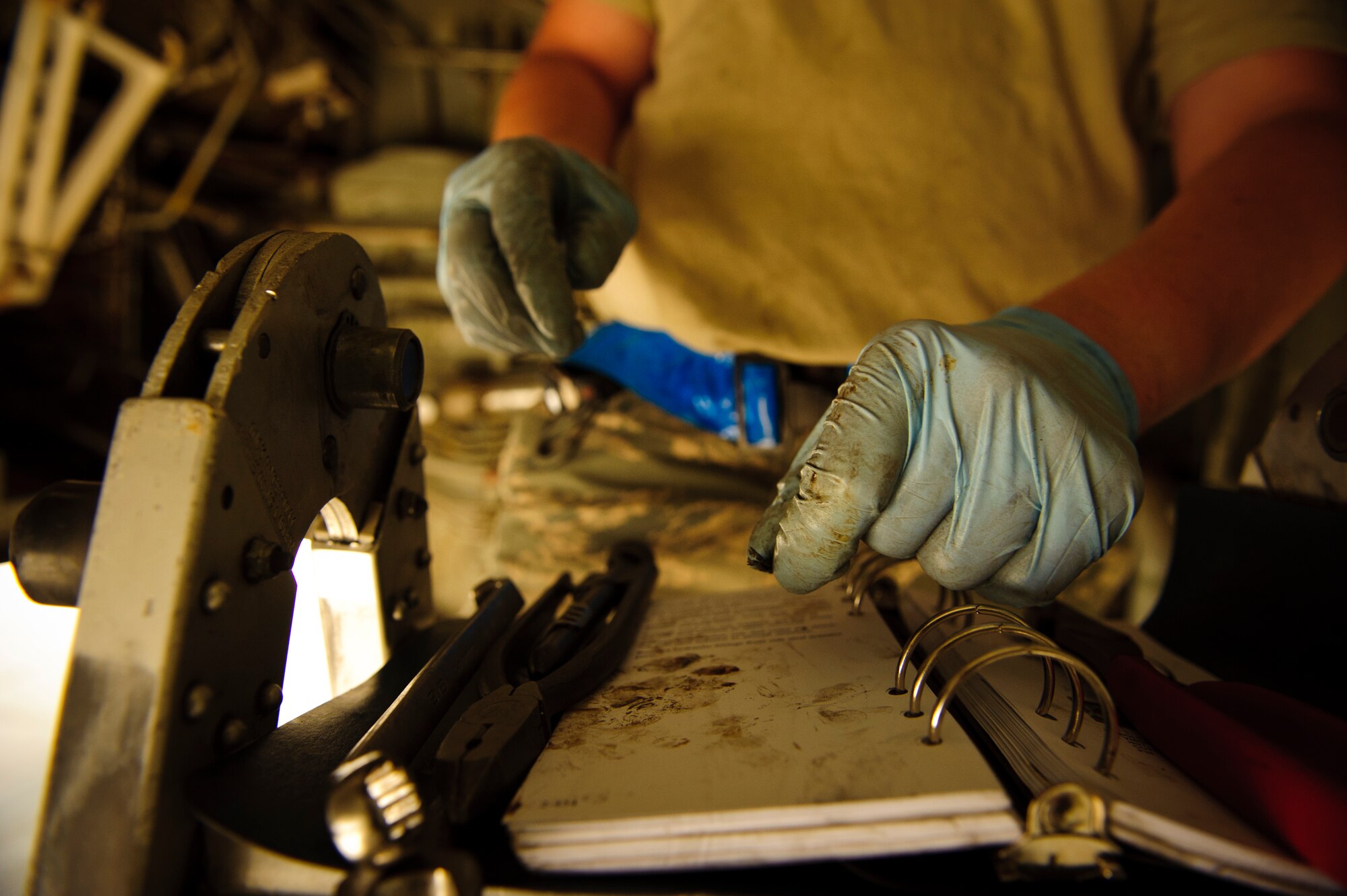 SOUTHWEST ASIA – Airman 1st Class Johnathan Holmes, 340th Expeditionary Aircraft Maintenance Unit hydraulics specialist and native of Hampden, Maine, removes cotter pins holding the side strut actuator for the main landing gear together on a KC-135 Stratotanker here April 4. Although this was Holmes’ first time replacing the actuator, most hydraulic systems are very similar. (U.S. Air Force photo/Staff Sgt. Nathanael Callon)