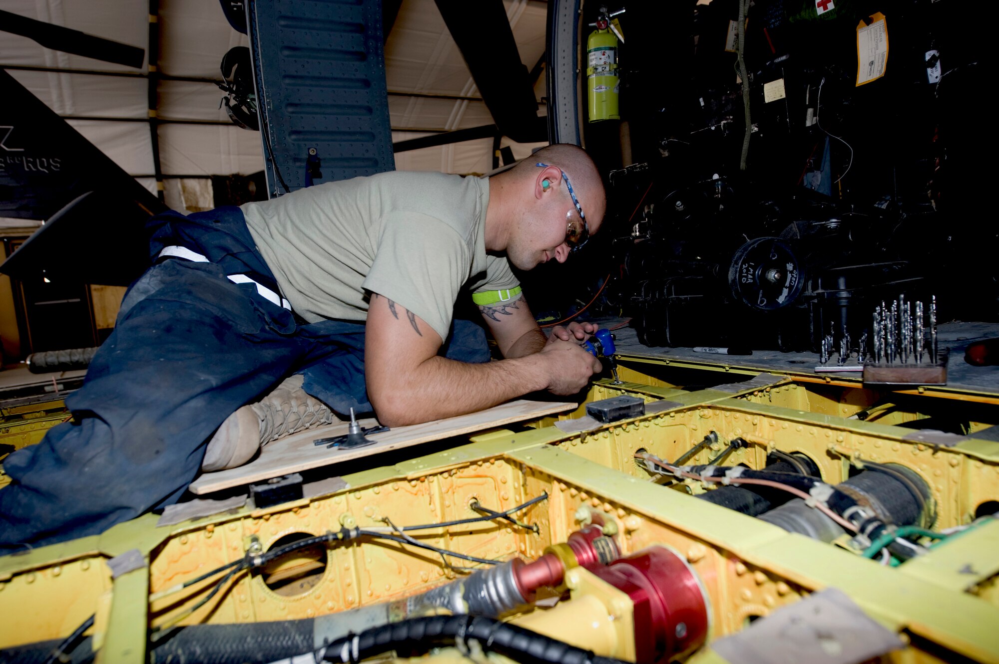 A 455th Expeditionary Aircraft Maintenance Squadron aircraft maintainer repairs a part on an HH-60 helicopter at Bagram Airfield, Afghanistan, April 27, 2011. The 455th EAMXS is responsible for the maintenance of military aircraft on Bagram. (U.S. Air Force courtesy photo)