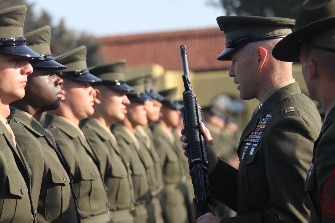 Company F recruits are inspected April 7 aboard Marine Corps Recruit Depot San Diego parade deck for their Battalion Commander's inspection. Recruits are required to know Marine Corps knowledge, know how to properly wear their Service "A" uniform, and how to keep their their M-16 A4 service rifles clean.