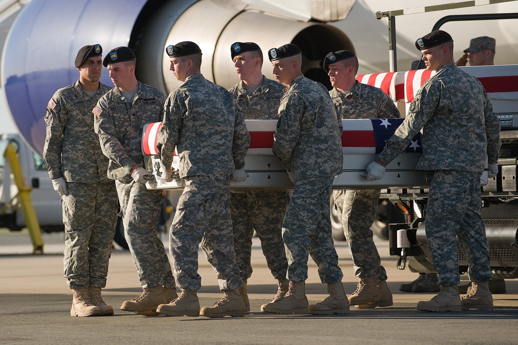 A U.S. Army carry team transfers the remains of Army Capt. Nicholas J. Rozanski, of Dublin, Ohio, at Dover Air Force Base, Del., April 7, 2012. Rozanski was assigned to the 1st Battalion, 148th Infantry Regiment, 37th Infantry Brigade Combat Team, Ohio National Guard, Walbridge, Ohio. (U.S. Air Force photo/Steve Kotecki)
