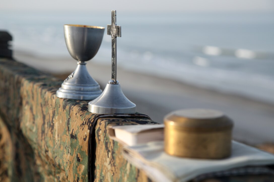 Navy Lt. Cmdr. David D. Dinkins, chaplain, Command Element, 15th Marine Expeditionary Unit, brought a chalice, a crucifix, a bible and a pix to the field in order to host religious services away from home for his unit’s Marines and sailors, here,  April 8. While training is the number one priority, seven religious services were held to allow the servicemembers to practice their faith even though they are away from home during MEU Exercise. Marine Expeditionary Unit Exercise is designed to train the unit as a Marine Air Ground Task Force in preparation for their upcoming deployment. Marine Expeditionary Unit Exercise is the first exercise that integrates all elements of the Marine Air Ground Task Force.