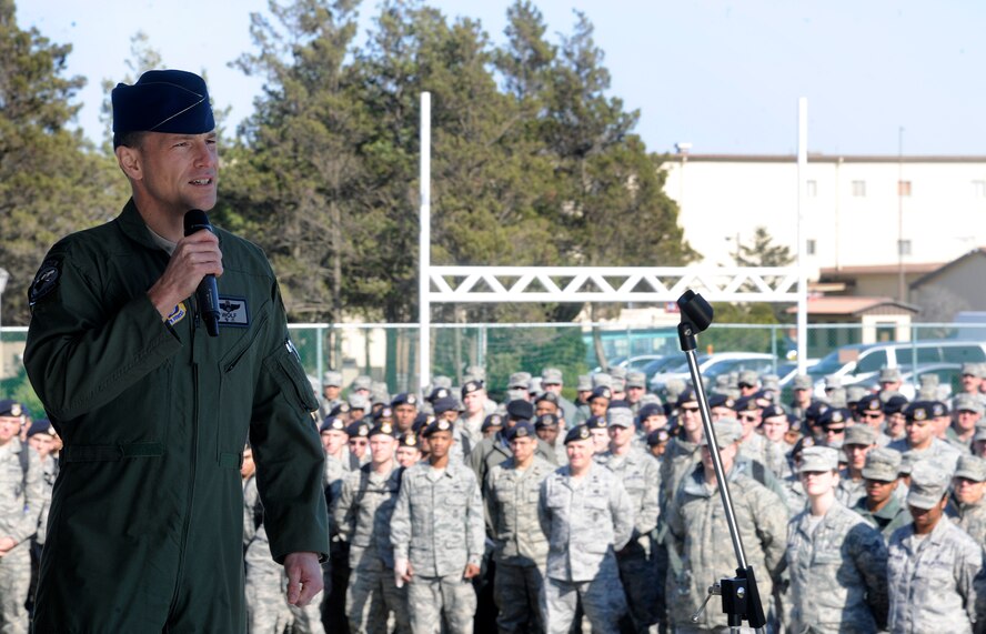 Col. Scott L. Pleus, 8th Fighter Wing commander, talks with Wolf Pack Airmen during an outside Wolf Call, April 6, 2012, on Kunsan Air Base, Republic of Korea. The Wolf Call served as an unofficial start to Kunsan’s Consolidated Unit Inspection, which will test and evaluate all aspects of the Wolf Pack. Pleus expressed his pride and admiration for all the hard work Airmen have accomplished in the past year, which has made Kunsan AB stronger and better equipped to handle anything thrown its way. (U.S. Air Force photo/Staff Sgt. Rasheen Douglas) 