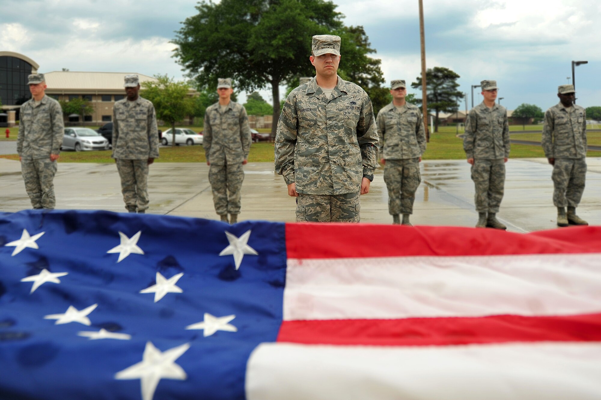 U.S. Air Force Tech Sgt. Shane Harvey, Airman Leadership School instructor, stands at attention with his flight of Airmen while rendering proper respects to the U.S. flag during a retreat ceremony, March 5, 2012, Shaw Air Force Base, S.C. Harvey has been an ALS instructor for just over three years. His preferred teaching method is a balance between humor and firm instruction. (U.S. Air Force photo by Senior Airman Kenny Holston)



