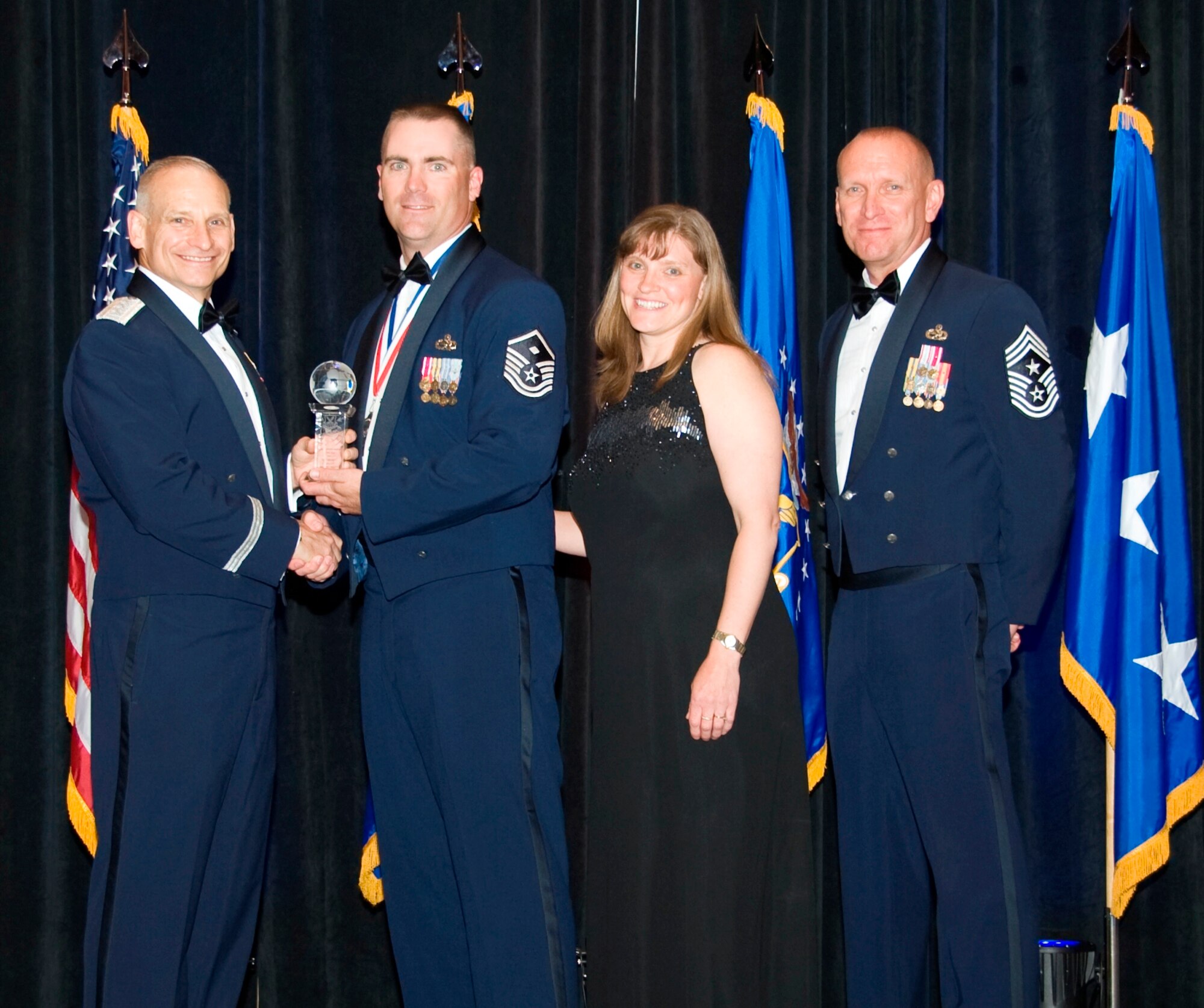 Honored with Air Force Global Strike Command Outstanding First Sergeant of the Year, Master Sgt. Shane C. Matt, 341st Missile Wing, receives his hardware from Lt. Gen. Jim Kowalski, AFGSC commander, and Chief Master Sgt. Brian Hornback, AFGSC command chief here April 5. (U.S. Air Force photo by Airman 1st Class Benjamin Gonsier)