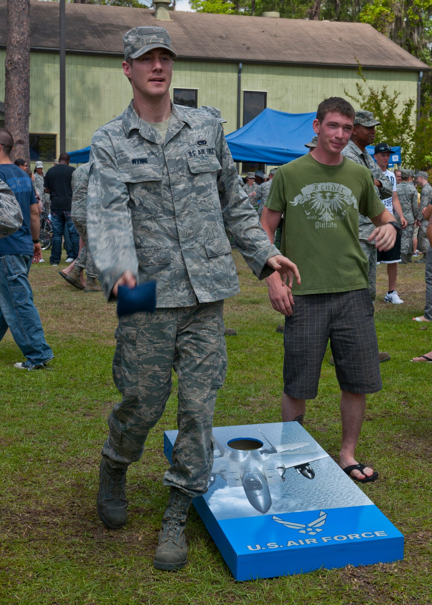 U.S. Air Force Senior Airman Joshua Wynne, 723d Aircraft Maintenance Squadron, plays corn hole during the 23d Wing post Operational Readiness Inspection party at the President George W. Bush Air Park at Moody Field April 6, 2012, at Moody Air Force Base, Ga. The party gave Airmen a chance to relax and unwind after the many months of preperation for a recent ORI. (U.S. Air Force photo by Senior Airman Eileen Meier/Released)
