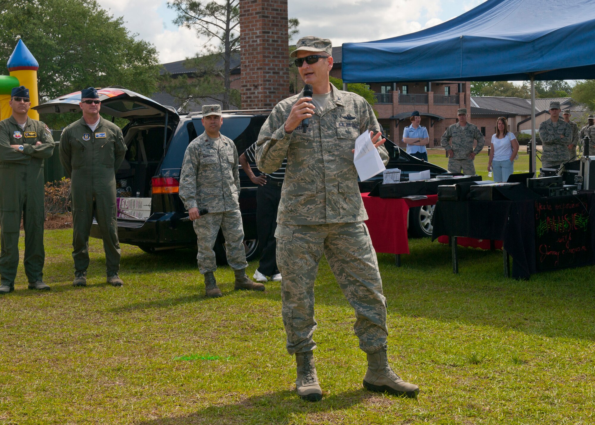 U.S. Air Force Col. Billy Thompson, 23d Wing commander, says a few words to kick-off the 23d WG post Operational Readiness Inspection party held at the President George W. Bush Air Park at Moody Field April 6, 2012, Moody Air Force Base, Ga. The Chiefs Group served as grill masters, and prepared food for Team Moody members and their families. Games, music and a bounce house were also available during the event. (U.S. Air Force photo by Senior Airman Eileen Meier/Released)
