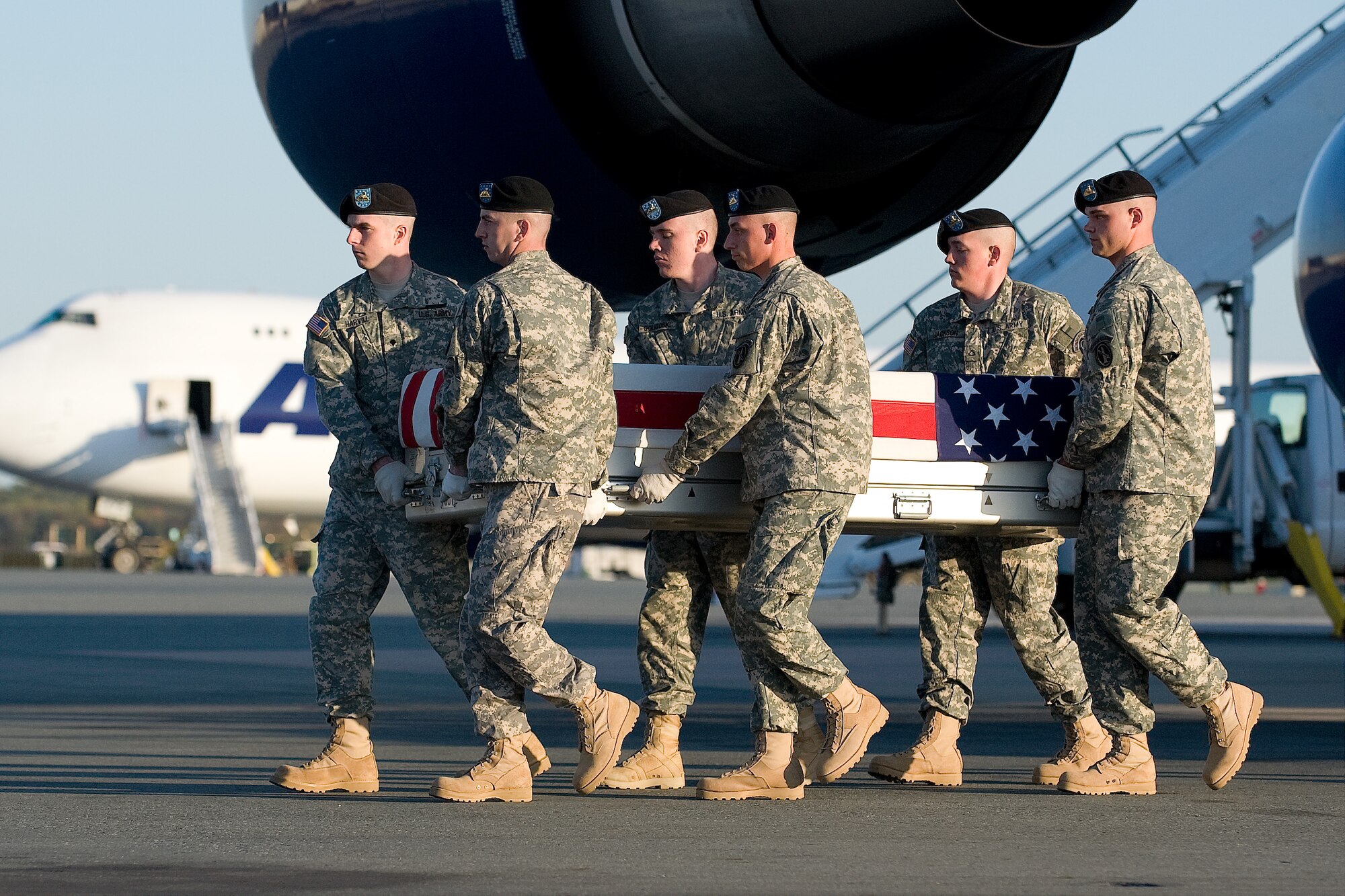 A U.S. Army carry team transfers the remains of Army  Spc. Antonio C. Burnside, of Great Falls, Mont., at Dover Air Force Base, Del., April 9, 2012. Burnside was assigned to the 1st Brigade Special Troops Battalion, 1st Brigade Combat Team, 82nd Airborne Division, Fort Bragg, N.C. (U.S. Air Force photo/Steve Kotecki)

