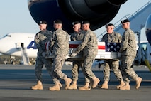 A U.S. Army carry team transfers the remains of Army  Spc. Antonio C. Burnside, of Great Falls, Mont., at Dover Air Force Base, Del., April 9, 2012. Burnside was assigned to the 1st Brigade Special Troops Battalion, 1st Brigade Combat Team, 82nd Airborne Division, Fort Bragg, N.C. (U.S. Air Force photo/Steve Kotecki)
