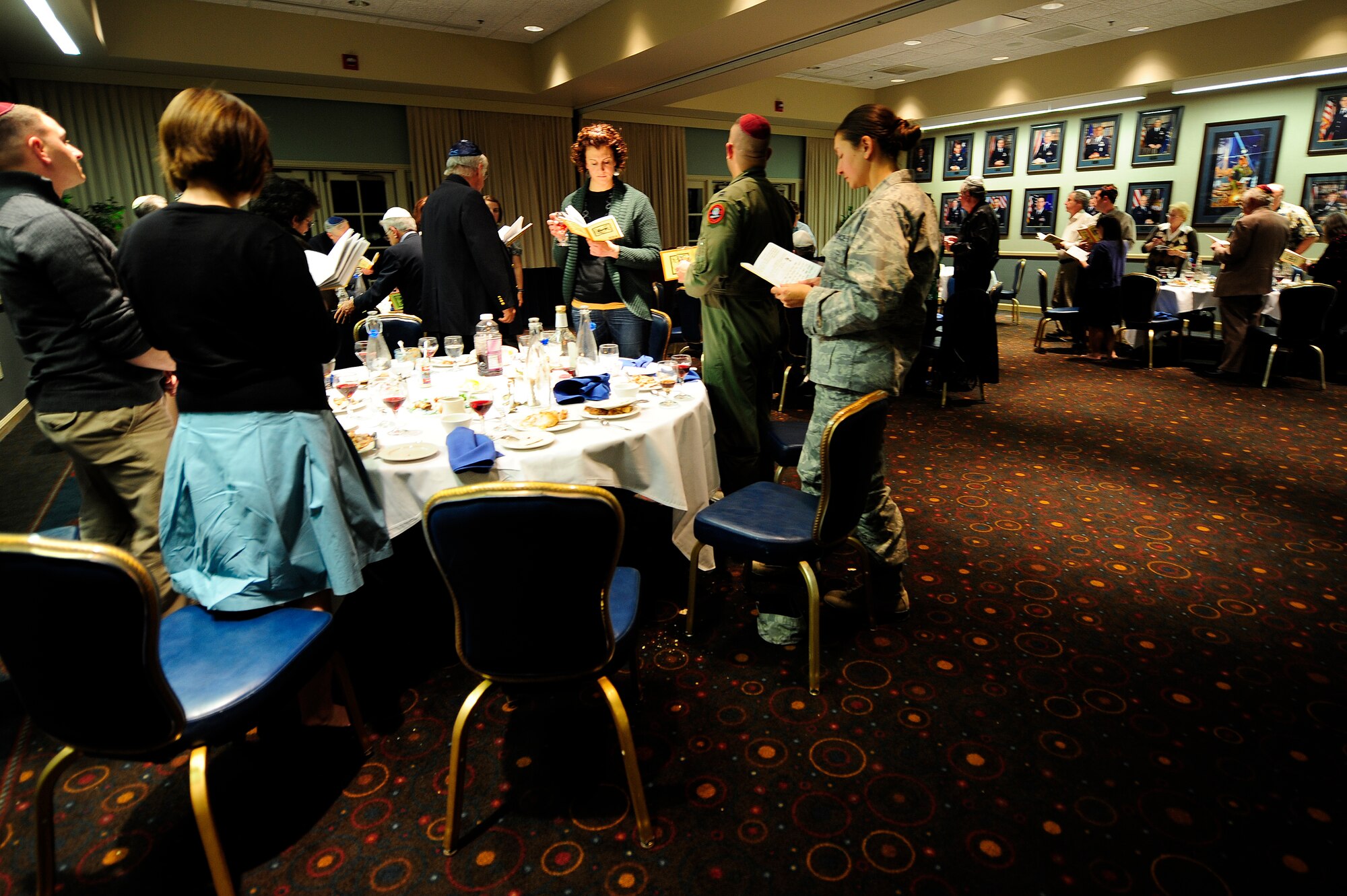 VANDENBERG AIR FORCE BASE, Calif.-- Reading a prayer together, Team V members and local Jewish community members take part in a Passover Seder at the Pacific Coast Club here Friday, Apr. 6, 2012. Passover tradition derive from the biblical story told in Exodus of the freeing of Israelites from Egypt. (U.S. Air Force photo/Staff Sgt. Andrew Satran) 

 