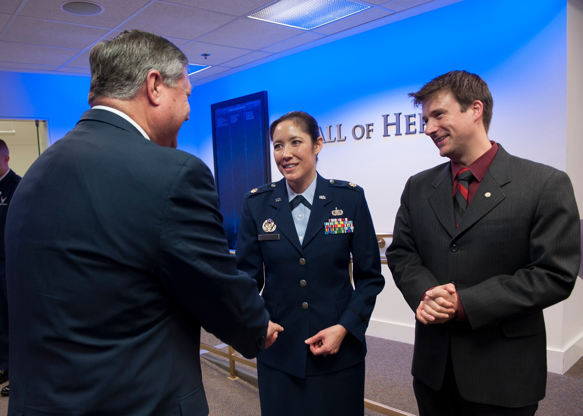 Secretary of the Air Force Michael Donley (left) congratulates Maj. Laura DeJong after she was presented the Lance P. Sijan USAF Leadership Award by Air Force Chief of Staff Gen. Norton Schwartz during a ceremony in the Pentagon's Hall of Heroes on April 6, 2012, Washington, D.C. The Sijan Award was created in 1981 to recognize individuals who demonstrate the highest qualities of leadership both in and out of uniform. Sijan, was an Air Force Academy graduate. At the time of his death he was an Air Force Captain and fighter pilot. He was shot down during a mission in Vietnam and later died while being held in a prisoner of war camp. He was awarded the Congressional Medal of Honor posthumously.  (U.S. Air Force photo by Jim Varhegyi)