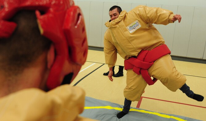 WARRENSBURG, Mo.  -- Senior Airman Jacob Larman, 509th Munitions Support Squadron armament technician, participates in a round of sumo wrestling during a “Late Night at UCM” event at UCM in the recreation center March 16. Whiteman AFB is one of two installations in the Air Force that is participating in Wing It events. (U.S. Air Force photo/Senior Airman Nick Wilson)