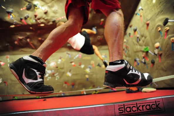 WARRENSBURG, Mo.  -- A student from the University of Central Missouri carefully positions his feet on a balancing beam during a “Late Night at UCM” event at UCM in the recreation center March 16. Airmen from the 509th Bomb Wing and student volunteers from the University of Central Missouri meet up every month to plan and coordinate activities that help reduce underage drinking among individuals in the 18 to 20 year old age group. (U.S. Air Force photo/Senior Airman Nick Wilson)