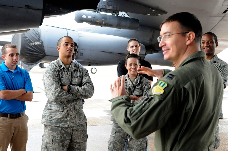 Air Force Reserve Officers' Training Corps cadets from Tulane University and Louisiana Tech University tour a B-52H Stratofortress on the flightline during their visit to Barksdale Air Force Base, La., March 30. Capt. David McClintic, 20th Bomb Squadron electronic warfare officer, speaks to the cadets about B-52 capabilities. (U.S. Air Force photo/Airman 1st Class Andrea F. Liechti) (RELEASED)