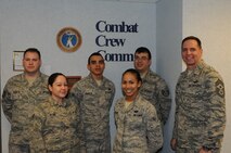From left to right: Tech. Sgt. Joseph Vairetta, Senior Airman Jessica Ayure, Airman 1st Class Javier Peralta, Airman 1st Class Jasmine Jackson, Staff Sgt. Wesley Burley and Chief Master Sgt. Kevin Jurgella

MINOT AIR FORCE BASE, N.D. -- The 5th Operations Support Squadron's combat crew communications staff is in charge of providing the reigns of communication for all of the 5th Bomb Wing's nuclear and conventional flying missions. They develop and issue the command's best combat mission folder packages, communication kits, and flight information publication bags. They also furnish aviators with error-free satellite connectivity components and cryptographic equipment necessary for safe and secure command and control communications. (Photo Submission/Tech. Sgt. Mark Frederici)

