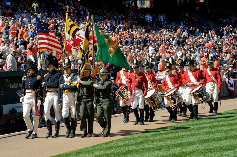 BALTIMORE, Md. -- A color guard presents the American Flag at the Baltimore Orioles' season opener April 4.  The 1st Helicopter Squadron from Joint Base Andrews, Md., contributed to the ceremonies with a flyover display during The National Anthem.    (Photo/Bobby Jones)