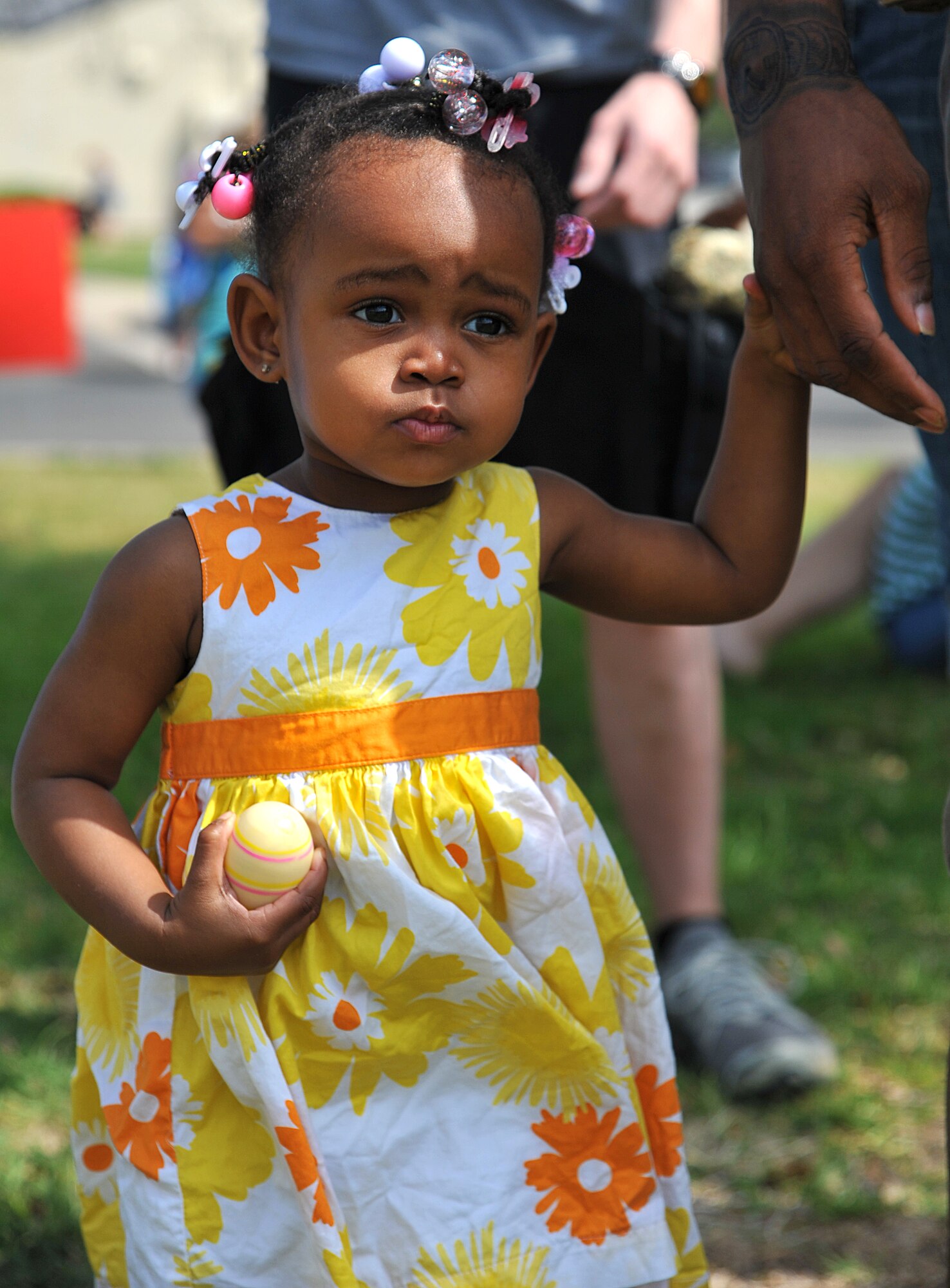 GOODFELLOW AIR FORCE BASE, Texas-- Kimora Williams, daughter of Airman 1st Class Kyeshlea Williams, 17th Communications Squadron, holds an egg during the 2012 Children’s Festival Egg Hunt April 7. The event had activities for kids of all ages to enjoy with their families. (U.S. Air Force photo/Airman 1st Class Michael Smith)