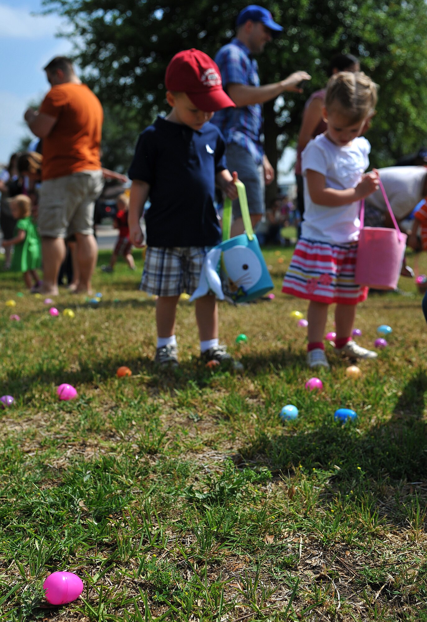 GOODFELLOW AIR FORCE BASE, Texas-- Parents watch as their kids collect eggs during the 2012 Children’s Festival Egg Hunt April 7. Children were separated into age groups to give each child the chance to collect as many eggs as possible. (U.S. Air Force photo/Airman 1st Class Michael Smith)