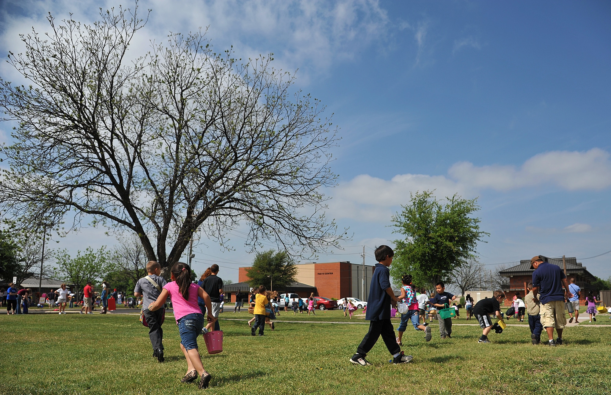GOODFELLOW AIR FORCE BASE, Texas-- Children run through the grass collecting eggs during the 2012 Children’s Festival Egg Hunt April 7. More than 300 people came to the fun filled event to relax and enjoy time with their families. (U.S. Air Force photo/Airman 1st Class Michael Smith)