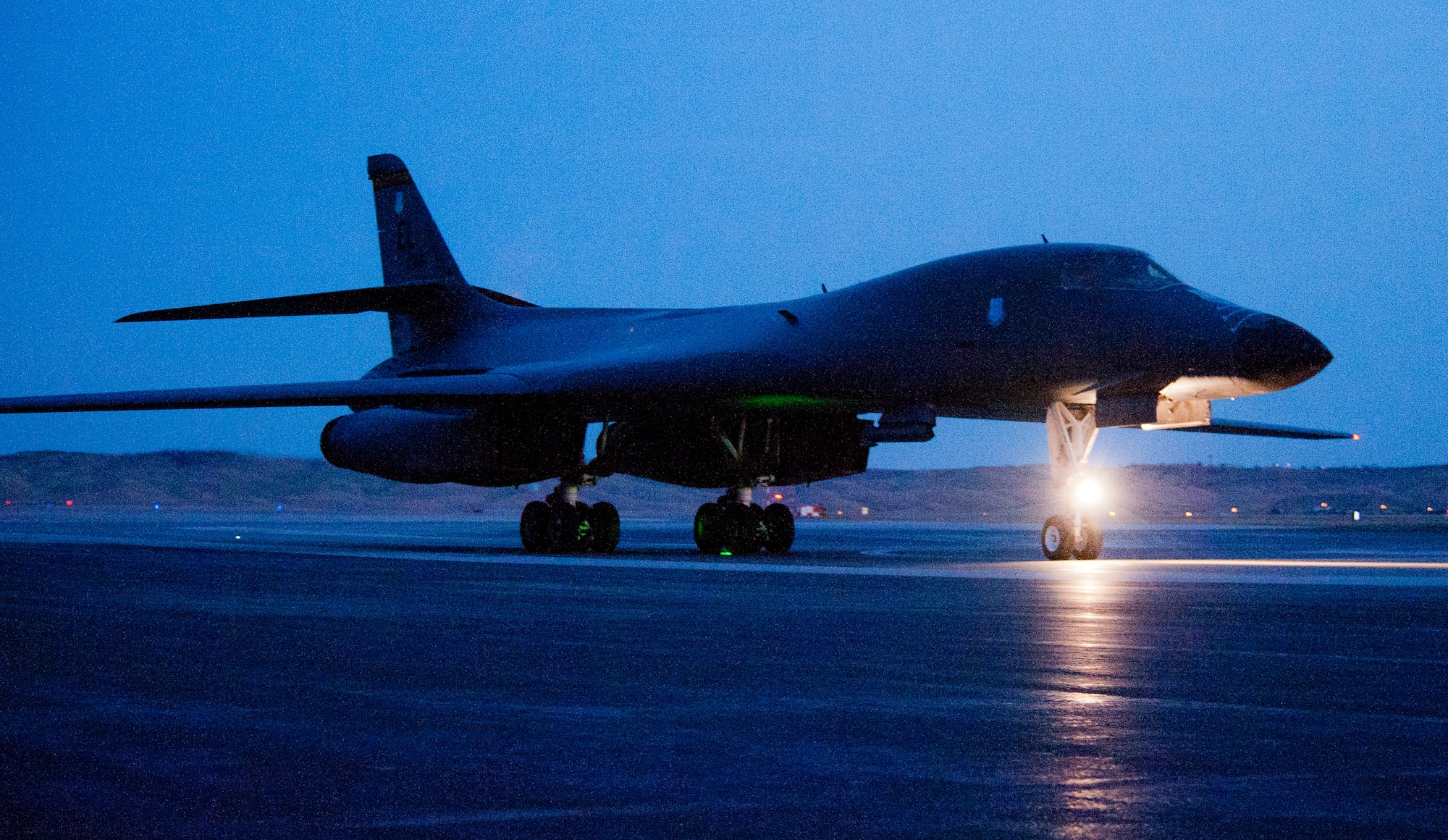 A B-1 bomber taxis off the runway at Ellsworth Air Force Base, S.D., April 4, 2012, following a combat training mission over the Fort Yukon Range, Alaska.  The purpose of the exercise was to flex all major muscle movements part of a long range strike exercise. (U.S. Air Force photo by Airman 1st Class Kate Thornton/Released)