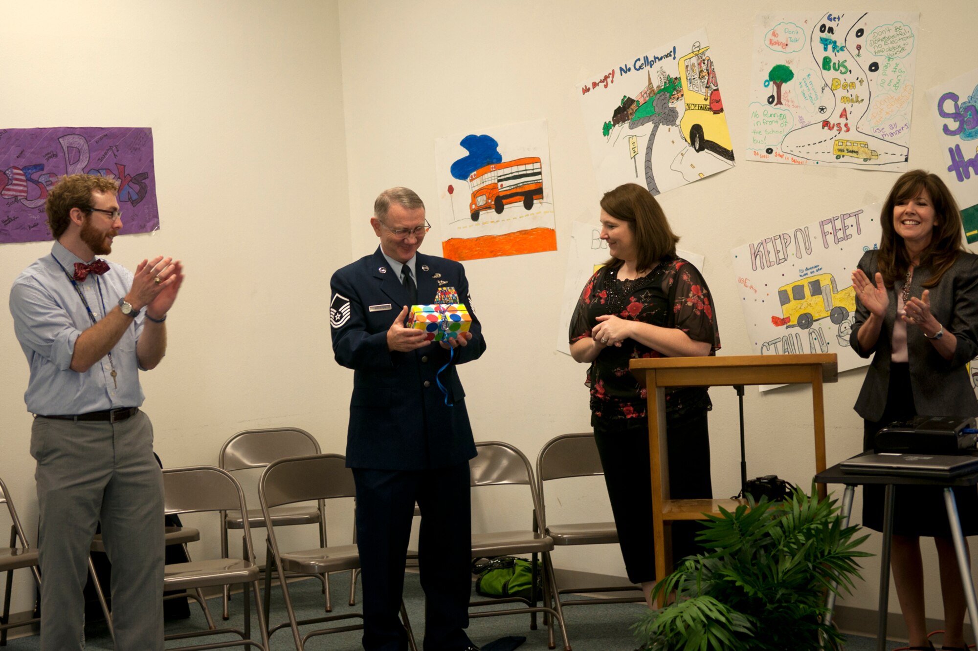 Benjamin Williamson, program instructor, Christy Bucker, technology coordinator & program instructor, and Kathy Brandon, executive director, STARBASE Louisiana, present a small token of their appreciation to Master Sgt. Jeff Walston, after he spoke to a group of 5th graders at Central Park Elementary school in Bossier City, La., April 5, 2012. Walston is a public affairs technician assigned the 307th Bomb Wing, Barksdale Air Force Base, La., and was the guest speaker for a graduation ceremony at the school.  The students completed an exciting 25-hour hands on/minds on aviation and aerospace course offered to area 5th grade students and their teachers by STARBASE Louisiana, at Barksdale. The program is one of 60 national STARBASE sites, and is sponsored by the 307th BW of the Air Force Reserve Command. Many U.S. Air Force servicemembers volunteer to speak at the graduation ceremonies to help motivate the students to continue their education. This was Walston’s third graduation ceremony. Speakers are always welcomed and always needed. Any officer or senior non-commissioned officer interested in motivating these young people should contact the 307th Bomb Wing Public Affairs Office at 318-529-3023 to be put on the speaker’s list. (Courtesy photo by Eva Klimentova)