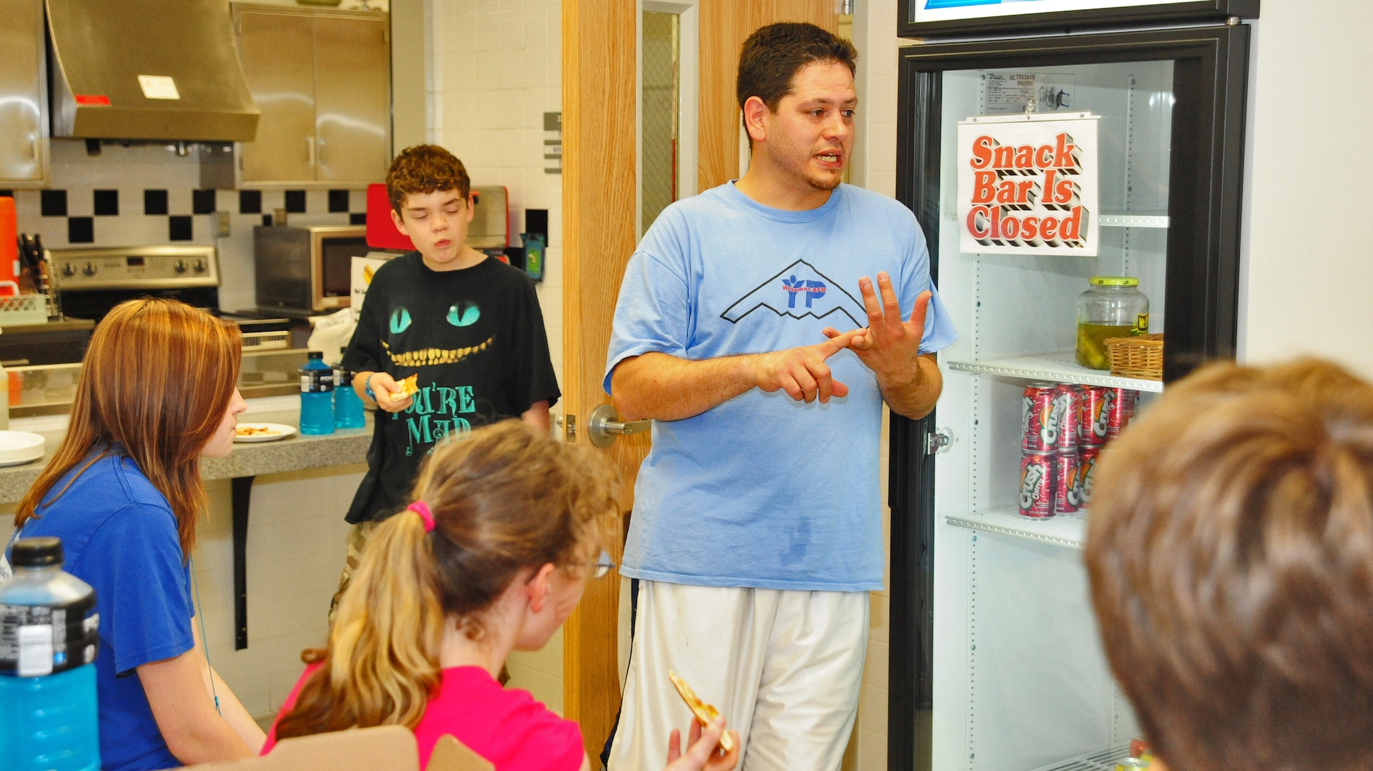 WHITEMAN AIR FORCE BASE, Mo. -- Gerald Torres, 509th Force Support Squadron Youth Center chief of youth programs, speaks to teens about teamwork, leadership and discipline during Operation Night Hoops March 30 in the Youth Center. The event included various basketball competitions, prizes, free snacks and drinks and had 26 participants. (U.S. Air Force photo/Senior Airman Nick Wilson)