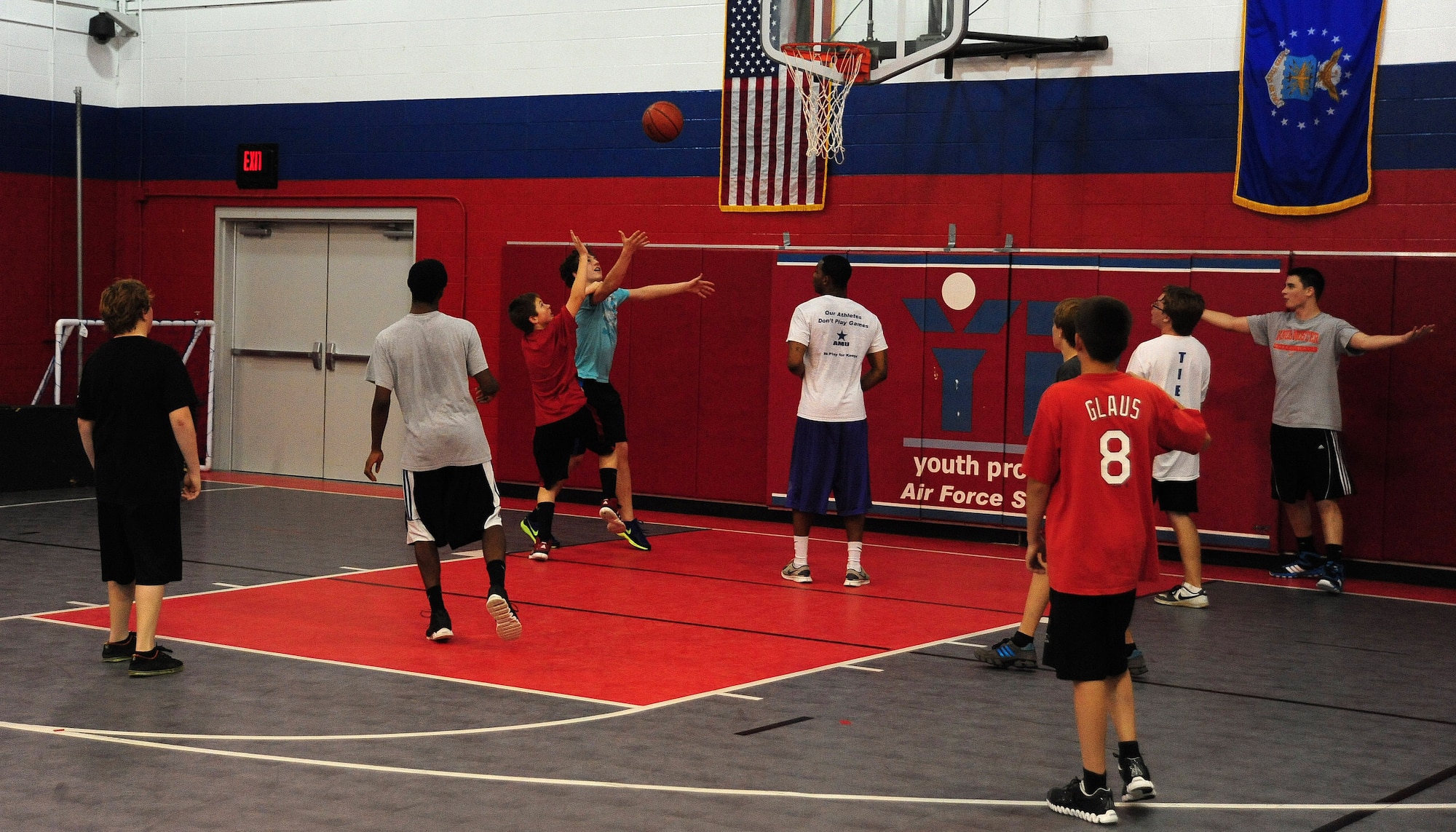 WHITEMAN AIR FORCE BASE, Mo. -- Teenagers participate in Operation Night Hoops March 30 in the Youth Center gymnasium. Operation Night Hoops is a free monthly basketball event in the Youth Center gymnasium which is offered to teenagers ages 13-18. (U.S. Air Force photo/Senior Airman Nick Wilson)