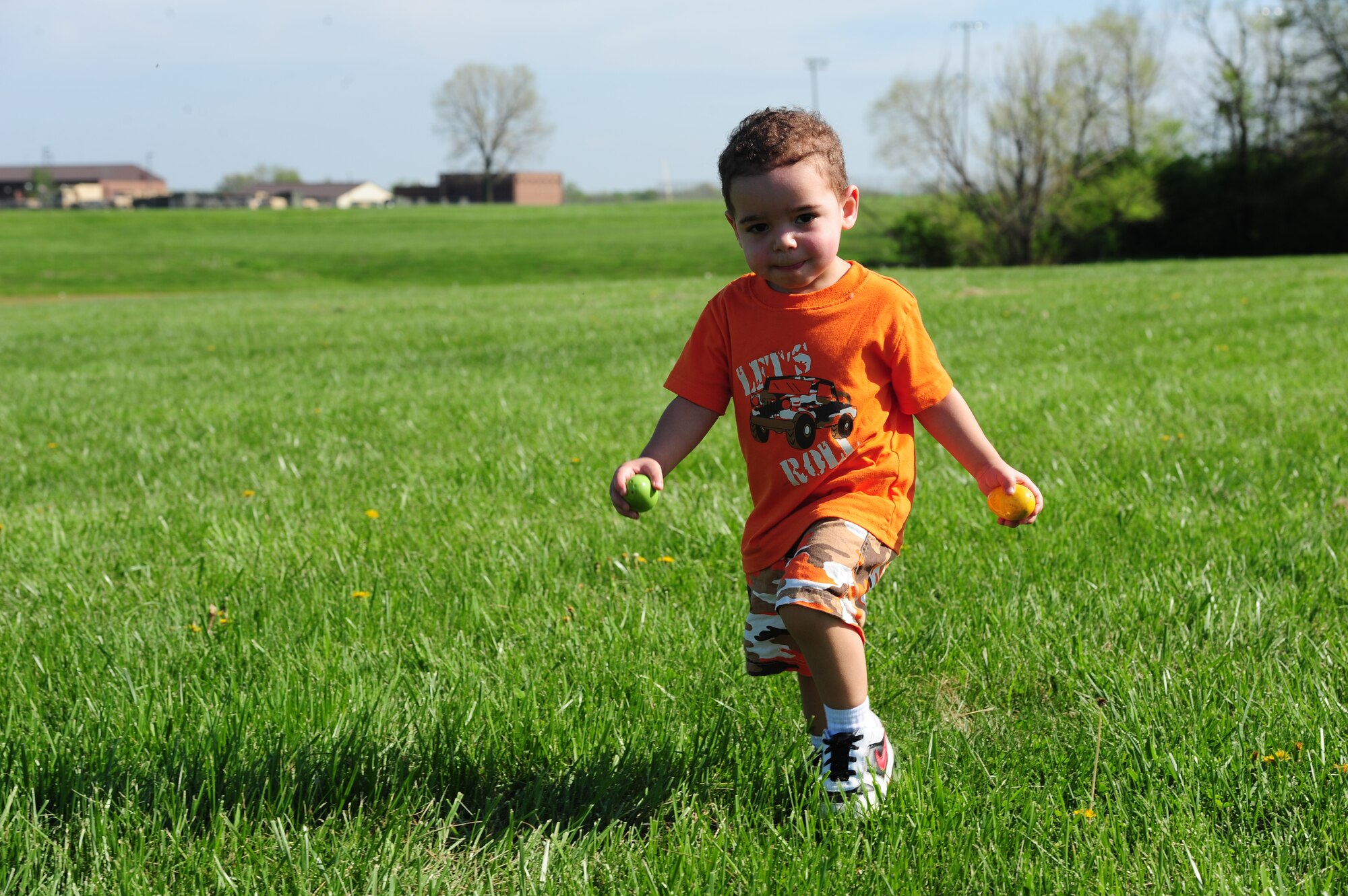 WHITEMAN AIR FORCE BASE, Mo. -- Jaden, son of Staff Sgt. Patrick Gore, 509th Aircraft Maintenance Squadron weapons load crew member, runs in the field in search of Easter eggs during a 509th AMXS Easter Egg Hunt at Ike Skelton Park March 31. Airmen and their families were invited to the event which was sponsored by the 509th AMXS Key Spouse group to encourage Airmen and families to get to know one another and have a relaxed social atmosphere. (U.S. Air Force photo/Senior Airman Nick Wilson)