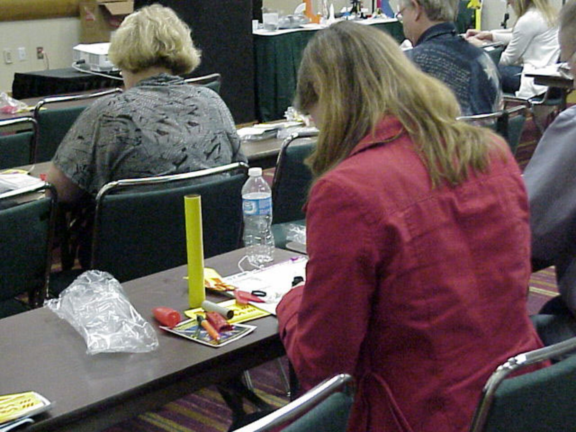 Teachers from across the nation build rockets during Cindy Henry’s presentation “Launch into STEM with Model Rocketry” during the National Science Teachers Association Conference in Indianapolis. (U.S. Air Force photo)