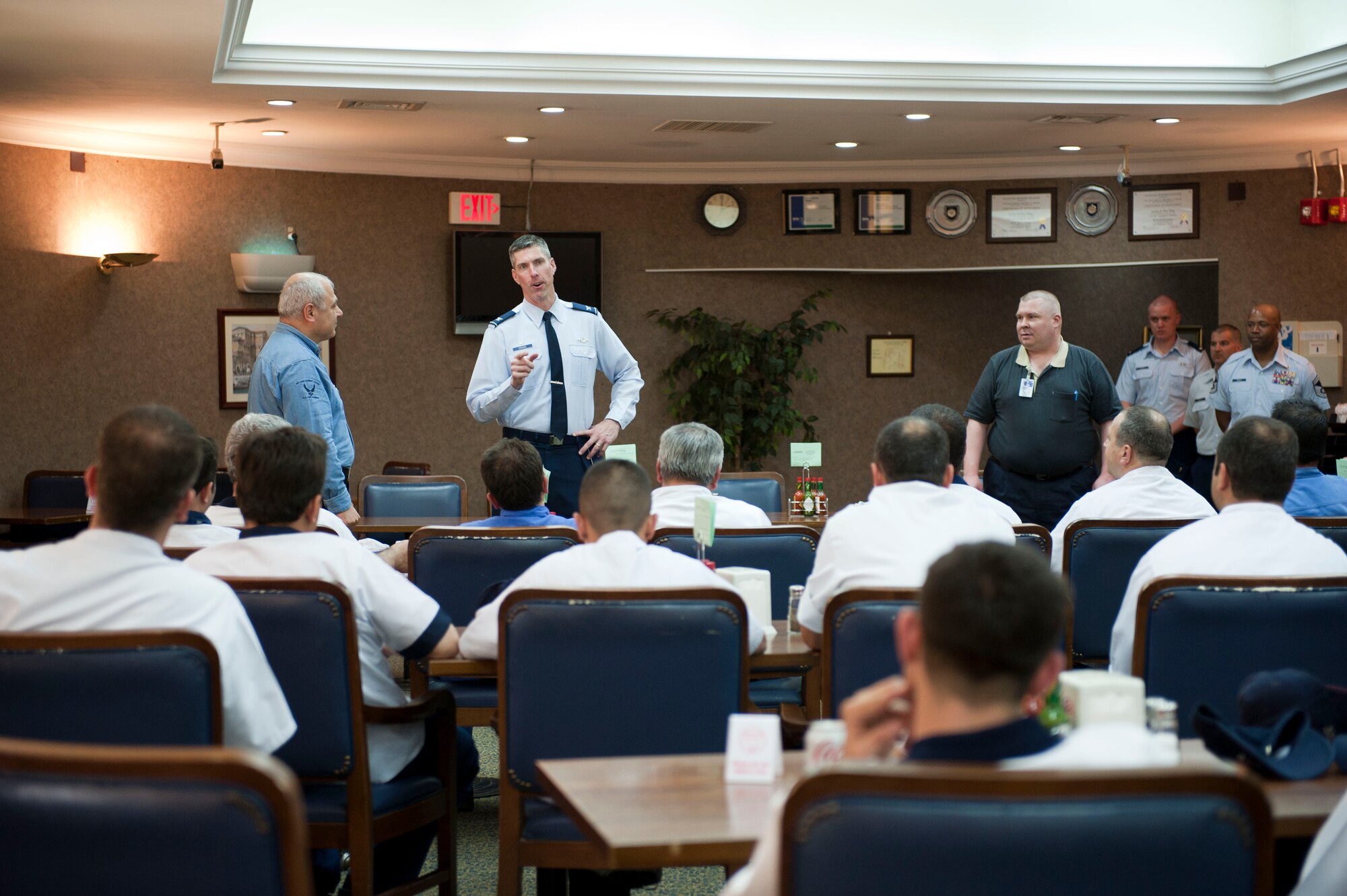 Col. Chris Craige, 39th Air Base Wing commander, congratulates the Sultan's Inn Dining Facility staff for receiving the 2012 John L. Hennessy Award, Single Unit Category, April 9, 2012, at Incirlik Air Base, Turkey. The award program was adopted in 1956 to promote food service competition, and inspire better management and command support of food service. This is the second time in three years the Sultan's Inn received the Air Force-level award. (U.S. Air Force photo by Senior Airman Clayton Lenhardt/Released)