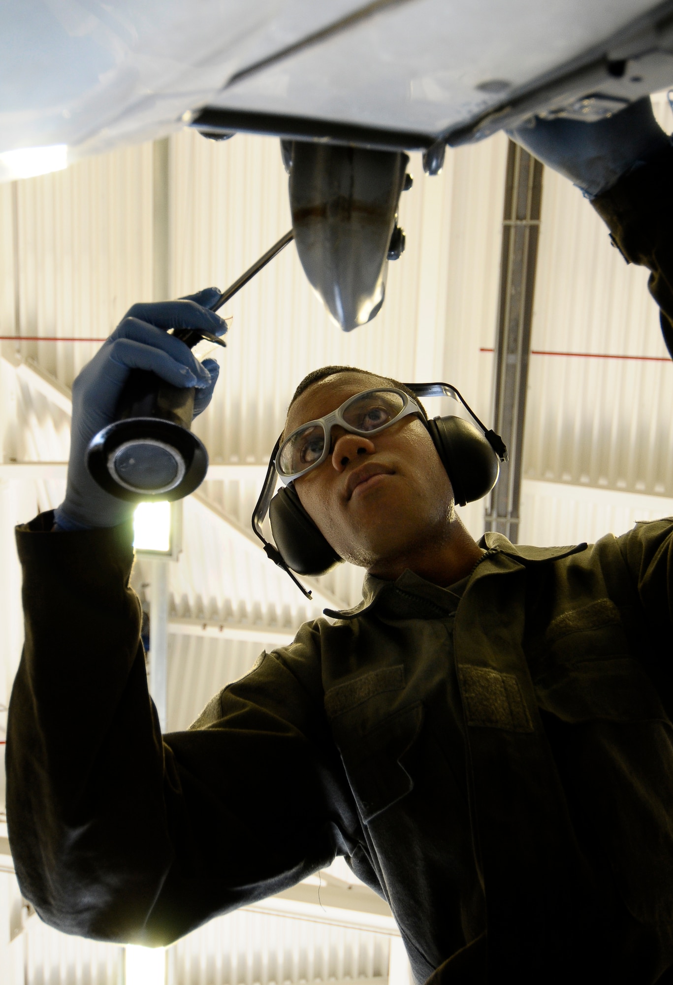 Airman 1st Class Demario Reid, 31st Munitions Squadron support equipment maintenance crew member, performs maintenance on a munitions trailer April 2 at Aviano Air Base, Italy. Members of the 31st MUNS recently earned the 2011 Air Force Maintenance Effectiveness Award, recognizing their achievements during Operations Odyssey Dawn and Unified Protector, all while continuing Aviano’s mission and supporting downrange deployments. (U.S. Air Force photo/Senior Airman Katherine Windish)
