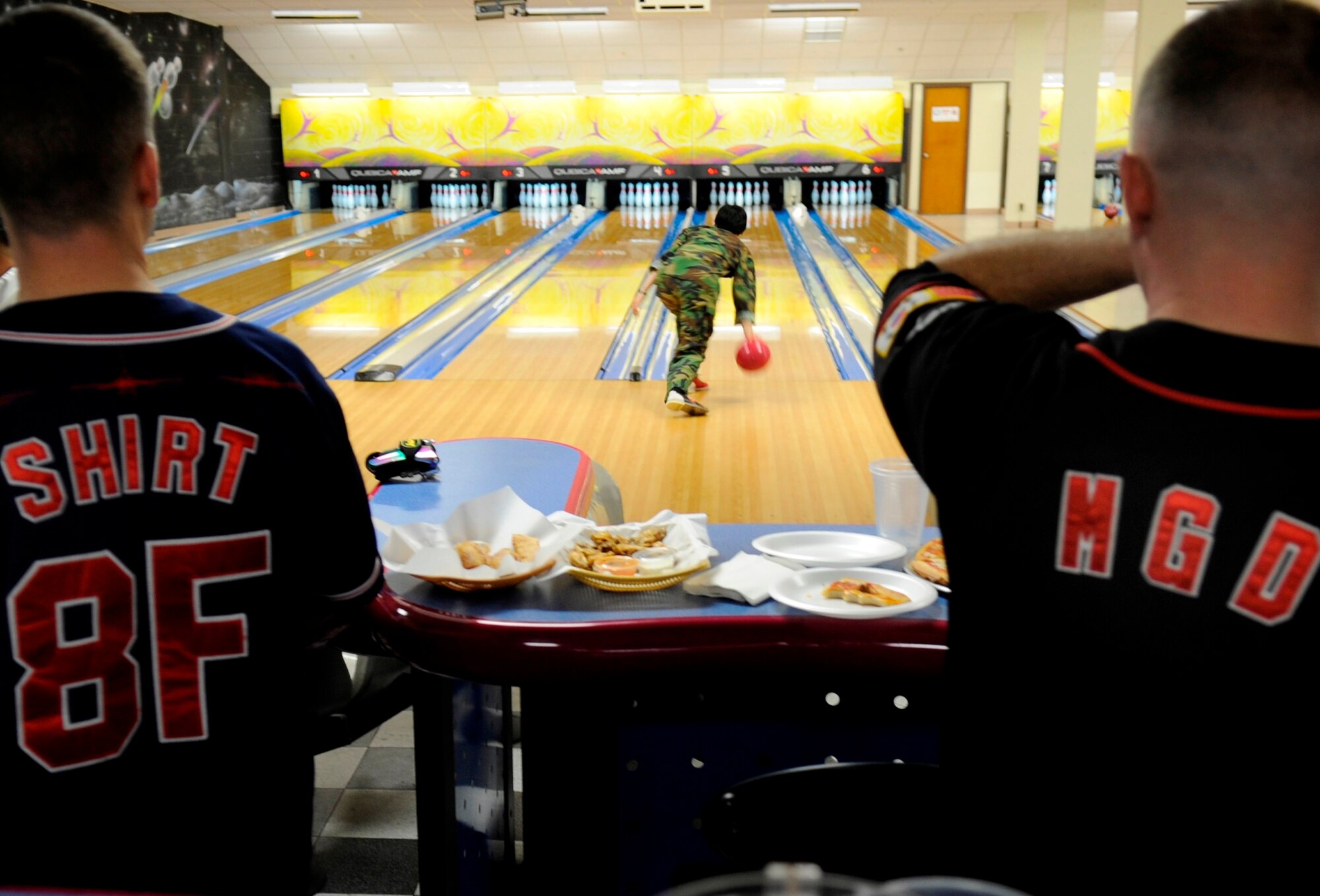 Senior enlisted members from the 8th Fighter Wing wait as a team member from the Republic of Korea 38th Fighter Group bowls during a ROKAF/U.S. Air Force Enlisted Friendship event, April 2, 2012 at the Take it North Bowling Center on Kunsan Air Base, ROK. Events like this help enlisted members build strong relationships, communication and team work with allies. 