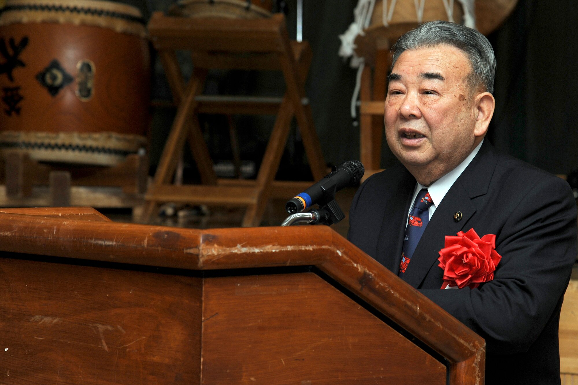 The Honorable Kazumasa Taneichi, Misawa City mayor, gives opening remarks during the 25th Annual Japan Day opening ceremony at Misawa Air Base, Japan, April 7, 2012. The event was sponsored by the Misawa International Club and was free of charge for the Misawa Air Base community. (U.S. Air Force photo by Tech. Sgt. Marie Brown/Released)
