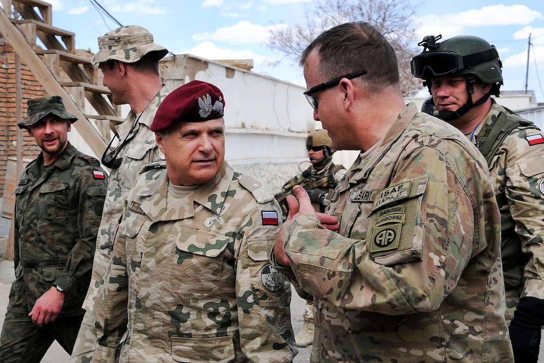 U.S. Army Col. Mark L. Stock speaks with Polish Brig. Gen. Bogdan Tworkowsk in Ghazni city in Afghanistan's Ghazni province, April 4, 2012. Stock is the commander of the 82nd Airborne Division’s 1st Brigade Combat Team.