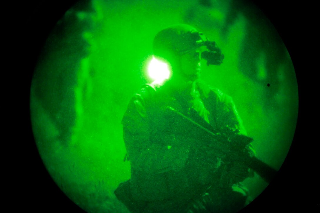 A Marine with the Assault Element of India Company, Battalion Landing Team 3/5, 15th Marine Expeditionary Unit, prepares to close with and destroy an objective during a helo raid conducted at night as a part of MEU Exercise, here, April 9. Marine Expeditionary Unit Exercise is designed to train the unit as a Marine Air Ground Task Force in preparation for their upcoming deployment. It is the first exercise that integrates all elements of the MAGTF. For many of the BLT Marines, this was their first opportunity to work with the other elements.