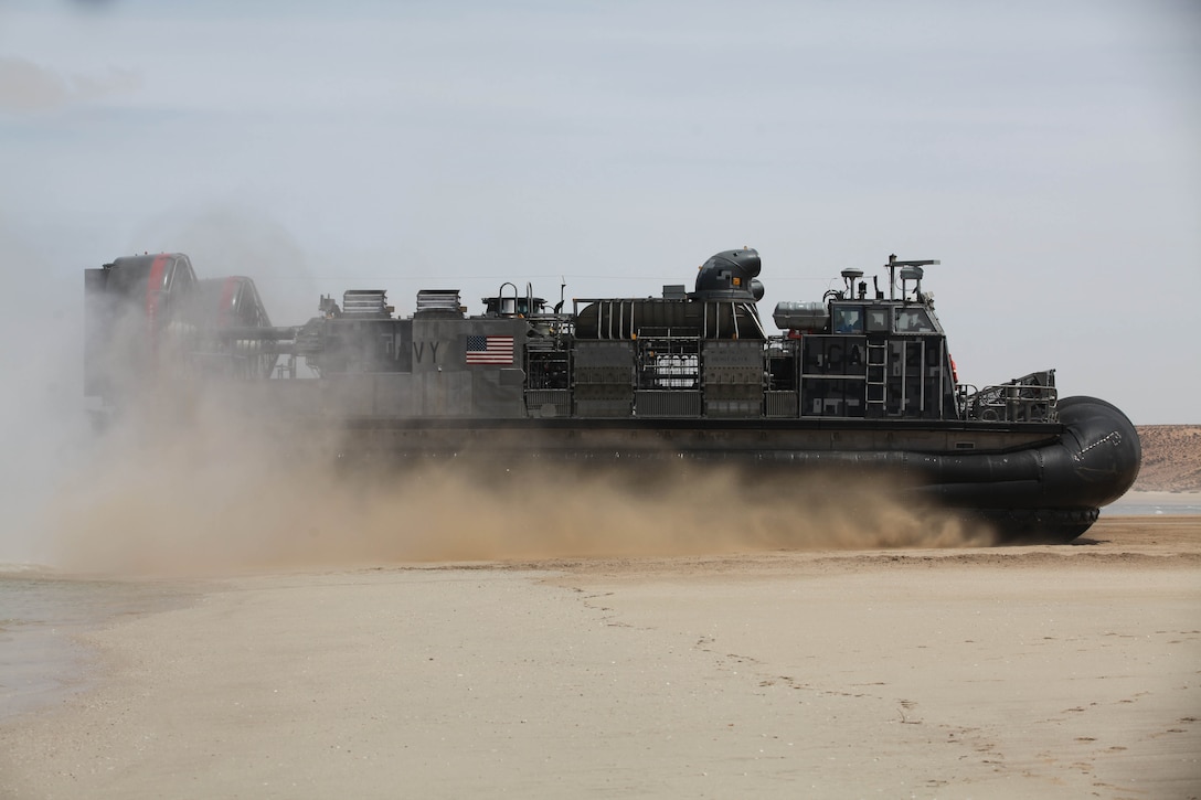 LCACs (landing craft air-cushioned) from the USS New York and USS Gunston Hall, transport mission essential gear, tactical vehicles and Marines, from the 24th Marine Expeditionary Unit, onto a beach during ship to shore movements, April 9, 2012. The 24th MEU, partnered with the Navy's Iwo Jima Amphibious Ready Group, is deploying to the European and Central Command theaters of operation to serve as a theater reserve and crisis response force capable of a variety of missions from full-scale combat operations to humanitarian assistance and disaster relief.