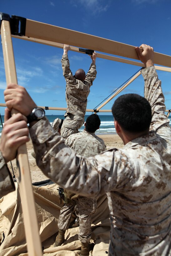 Marines with Combat Logistics Battalion 24, 24th Marine Expeditionary Unit, set up their command operations center on the beach to establish a base of operations, April 9, 2012. The 24th MEU, partnered with the Navy's Iwo Jima Amphibious Ready Group, is deploying to the European and Central Command theaters of operation to serve as a theater reserve and crisis response force capable of a variety of missions from full-scale combat operations to humanitarian assistance and disaster relief.