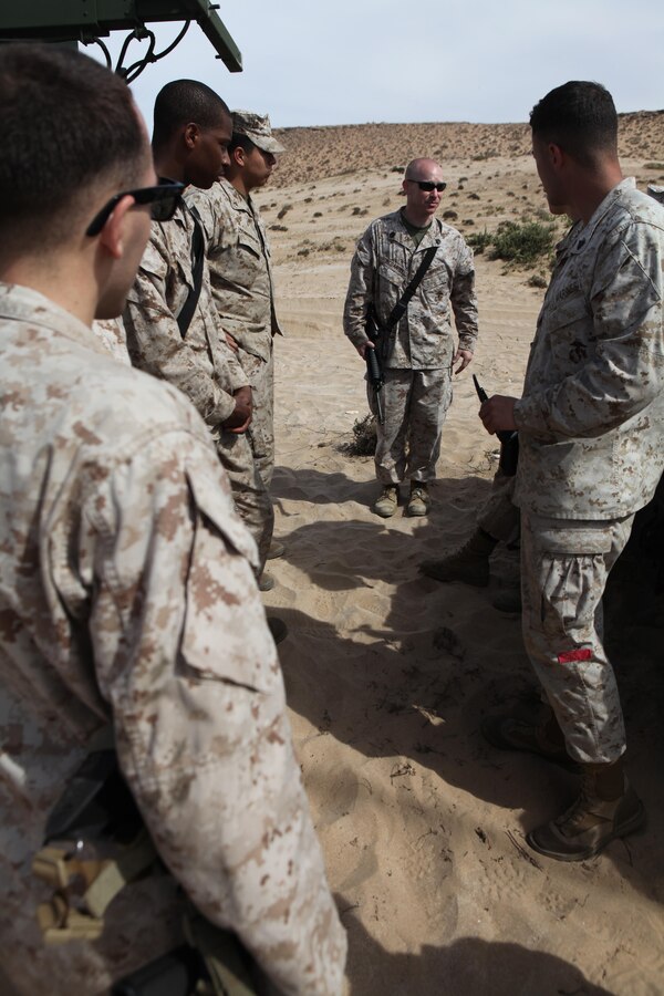 Staff Sgt. Rod McDaniel, center back, the landing support chief with Combat Logistics Battalion 24, 24th Marine Expeditionary Unit talks to his Marines about their roles and responsibilities during ship to shore movements, April 9, 2012. The 24th MEU, partnered with the Navy's Iwo Jima Amphibious Ready Group, is deploying to the European and Central Command theaters of operation to serve as a theater reserve and crisis response force capable of a variety of missions from full-scale combat operations to humanitarian assistance and disaster relief.